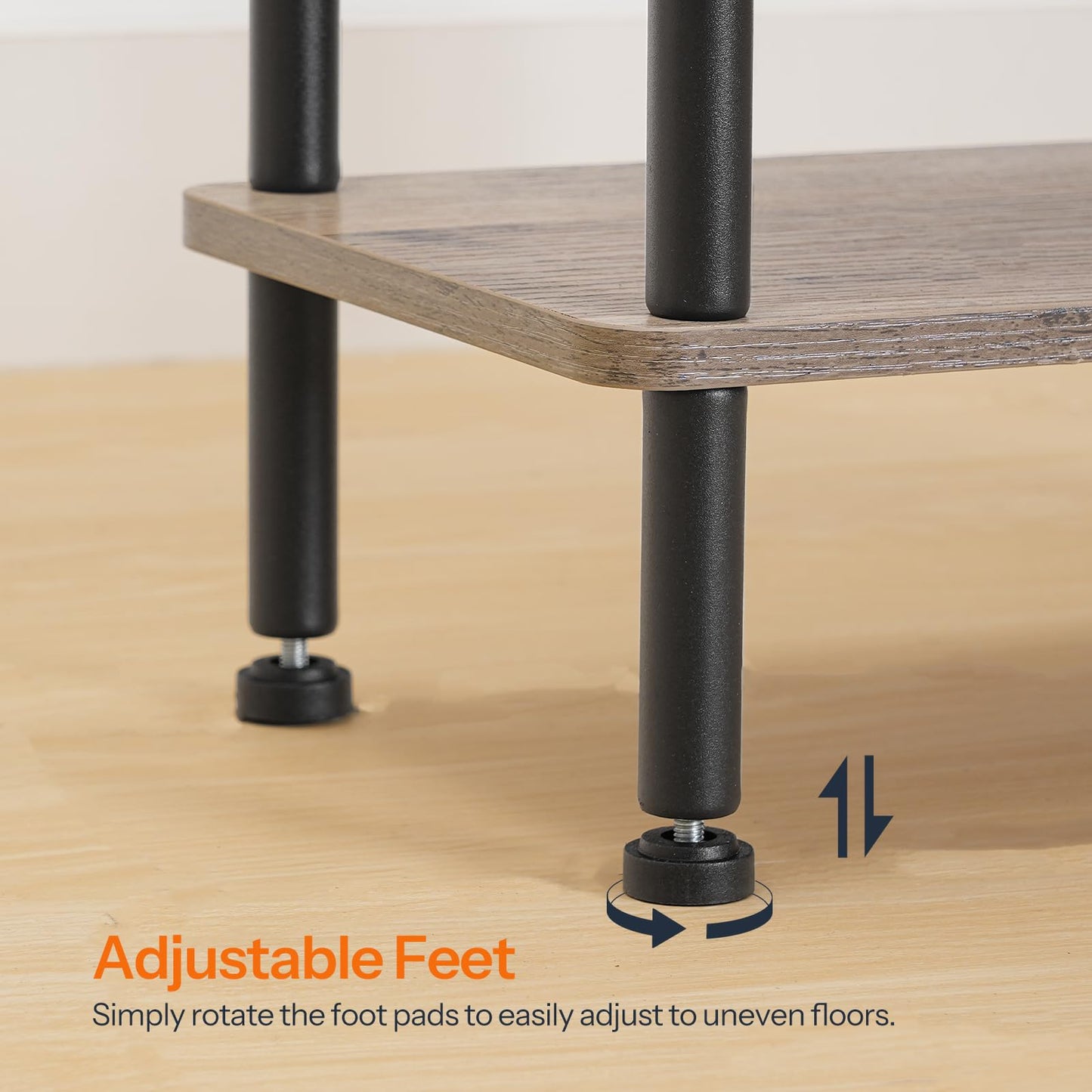 Wooden table with adjustable feet on a wooden floor