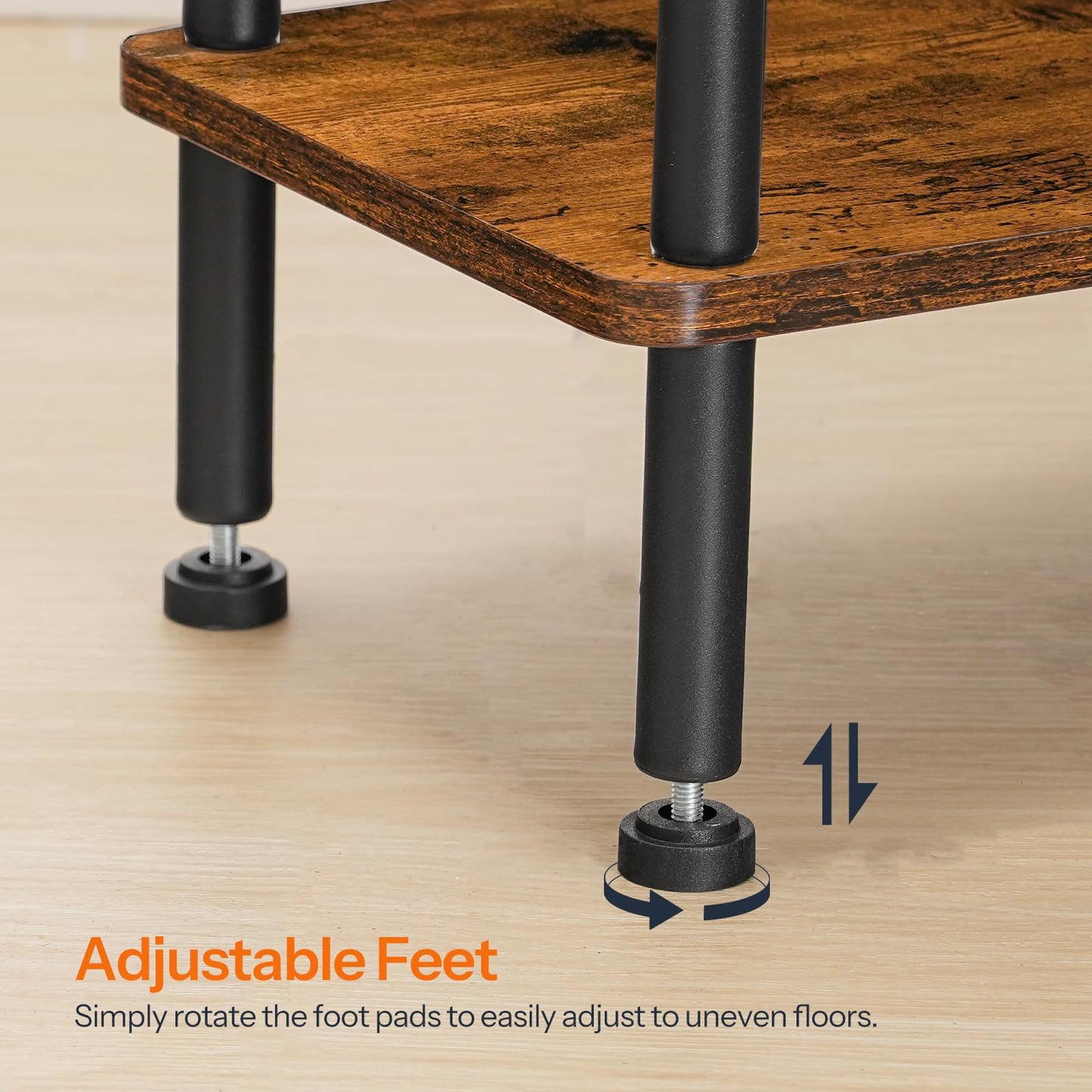 Wooden table with adjustable black feet on a wooden floor.