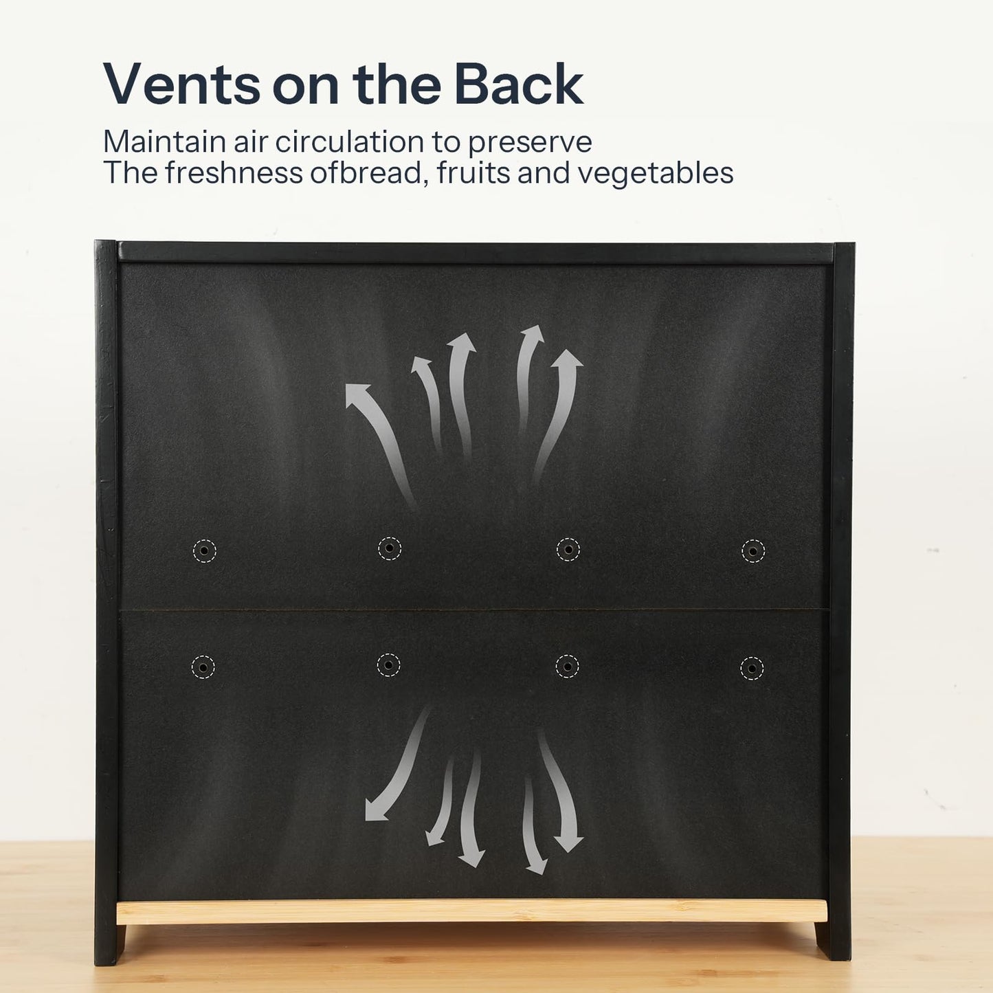 Black vegetable drawer with vent design on a wooden surface