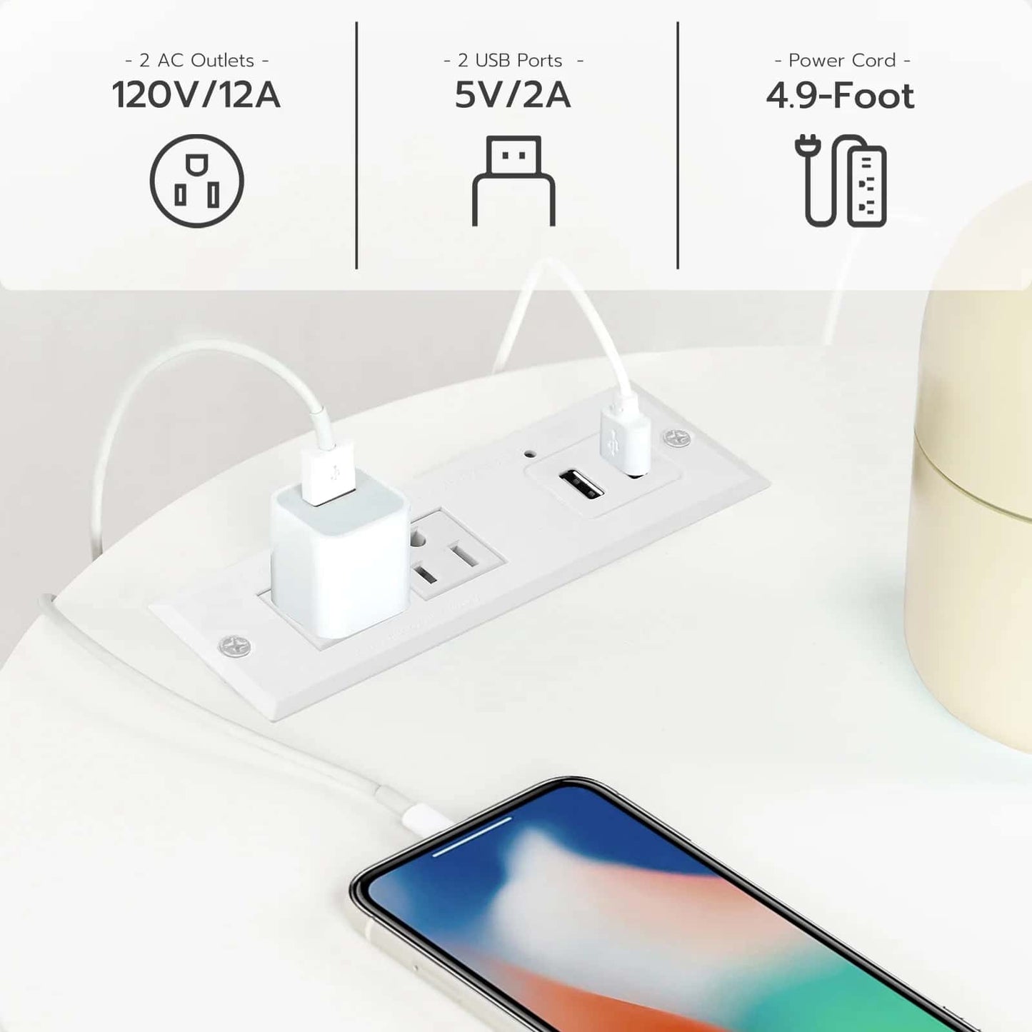 Power strip with AC outlets and USB ports, smartphone nearby on a light surface.