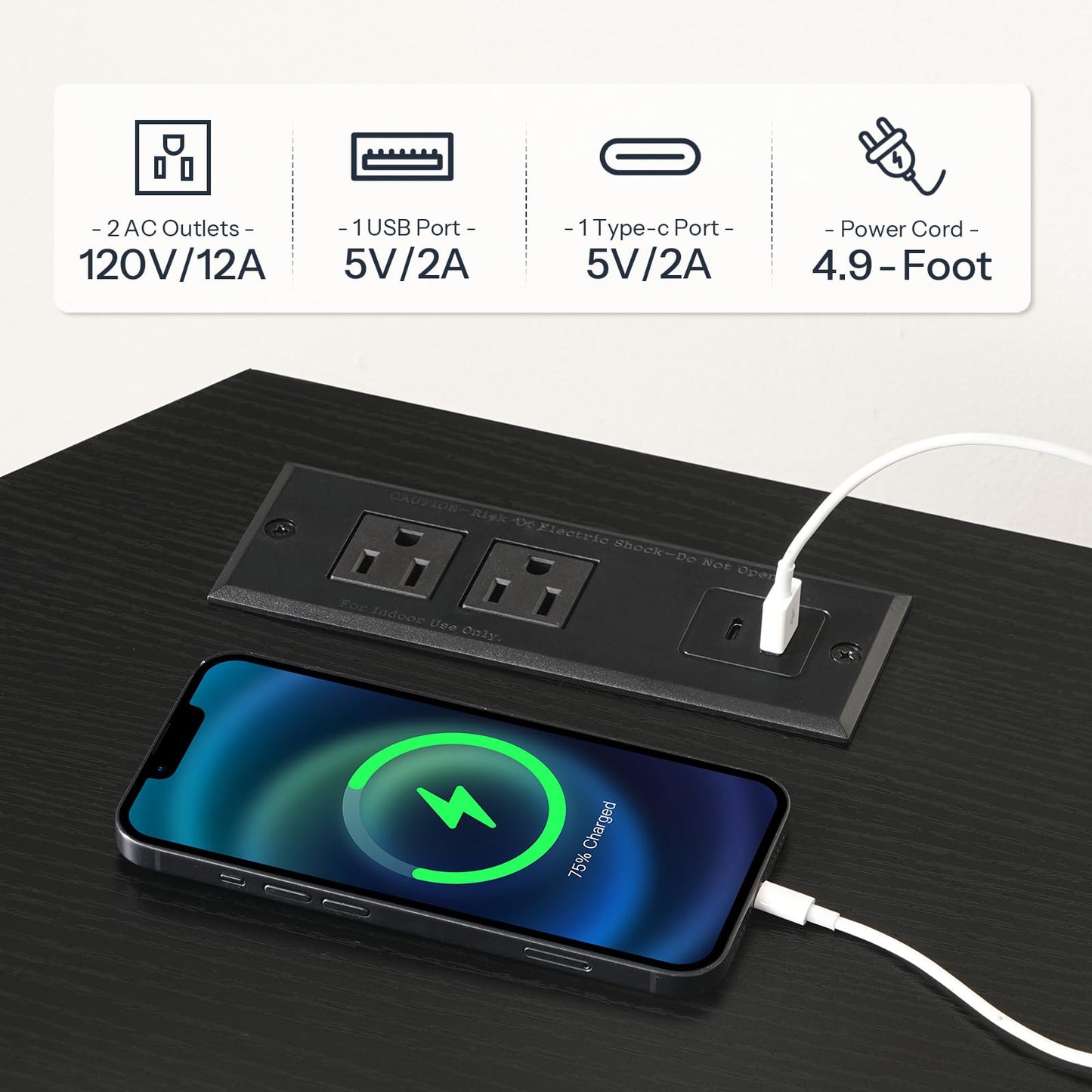 Power outlet with multiple ports and a smartphone being charged on a black surface.