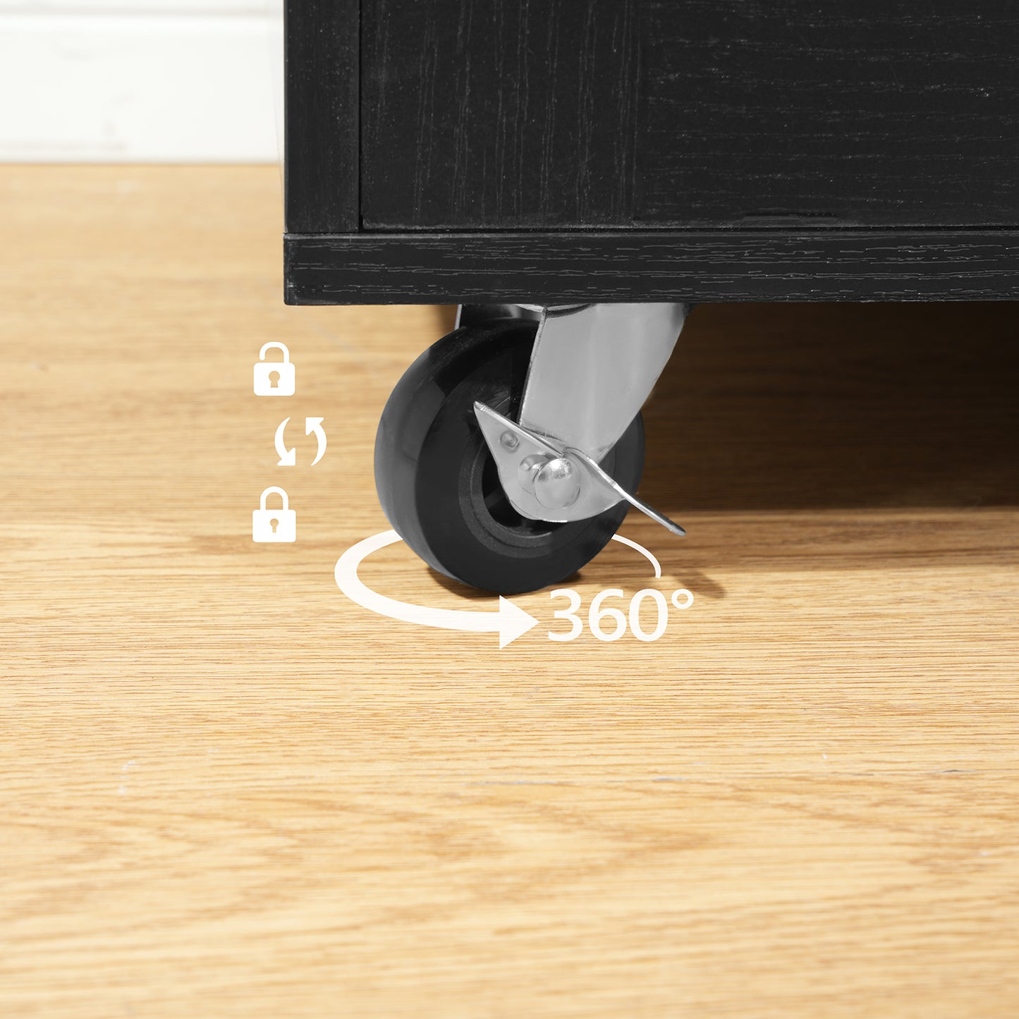 Close up of an industrial grade heavy duty 360 degree rotating caster wheel on a smooth wooden floor.