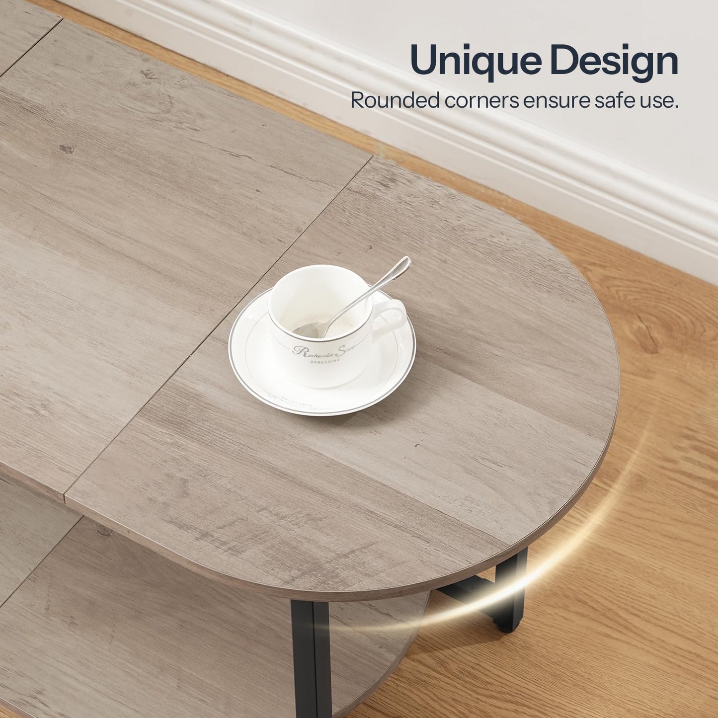 Close-up shot of the unique oval wood tabletop highlighting smooth curved edges and rounded safety corners.