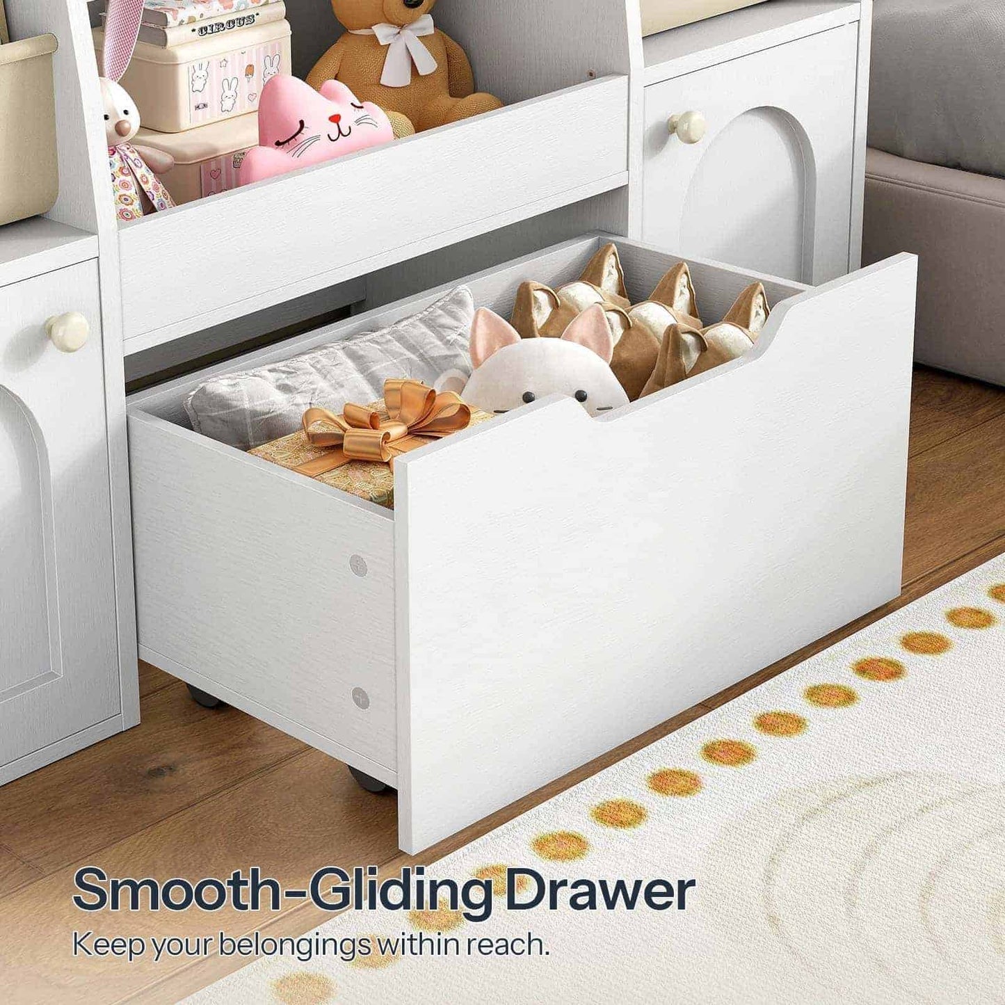 Close-up of the large smooth-gliding bottom drawer pulled open and filled with teddy bears.