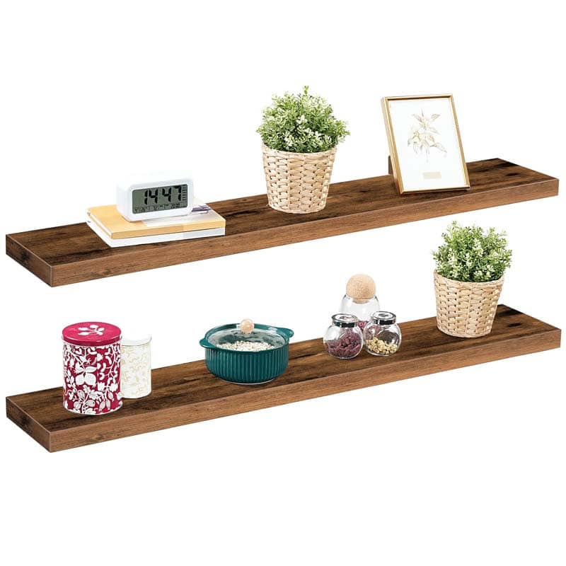 Two pieces of wall-mounted rustic display ledges holding books, small succulent pots, and decorative home ornaments.