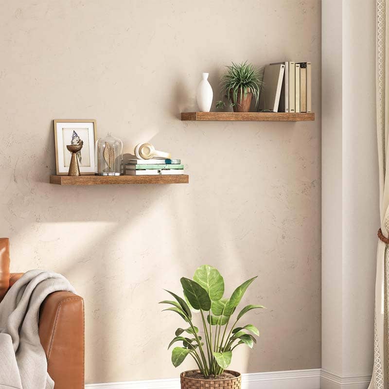 HOOBRO rustic floating shelves set of 2 in vintage brown wood displayed on a living room wall with books and plants.