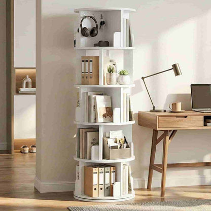Modern white 360-degree rotating bookshelf styled with books, folders, and headphones next to a wooden desk.