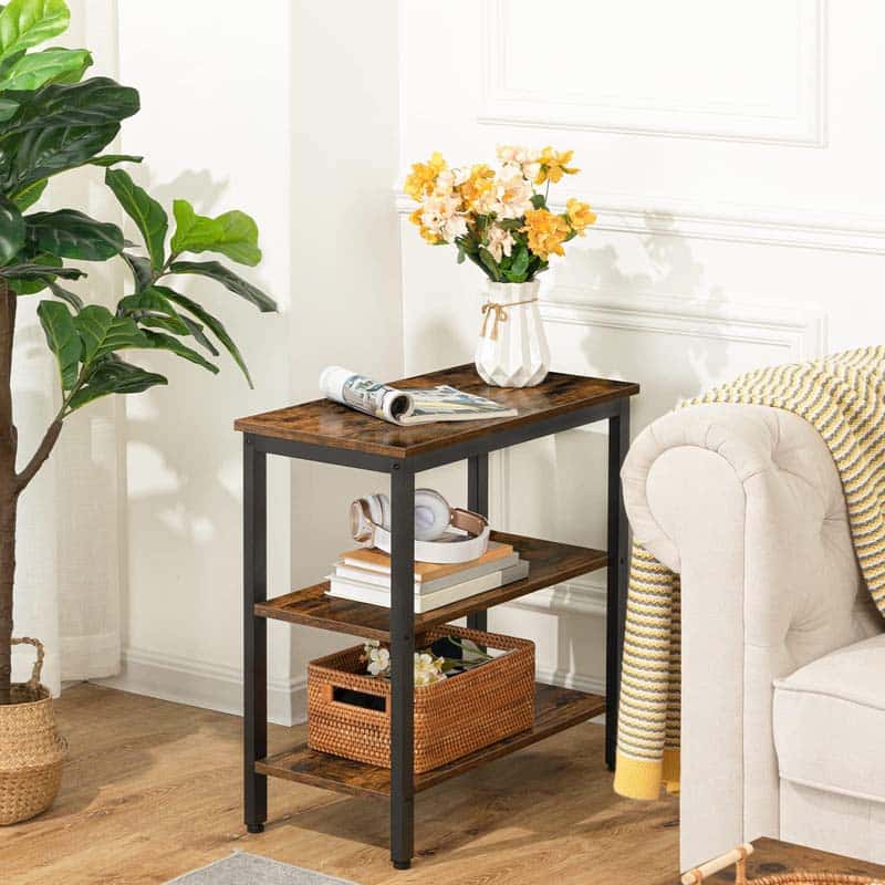 HOOBRO skinny 3-tier end table next to a fabric couch holding a flower vase