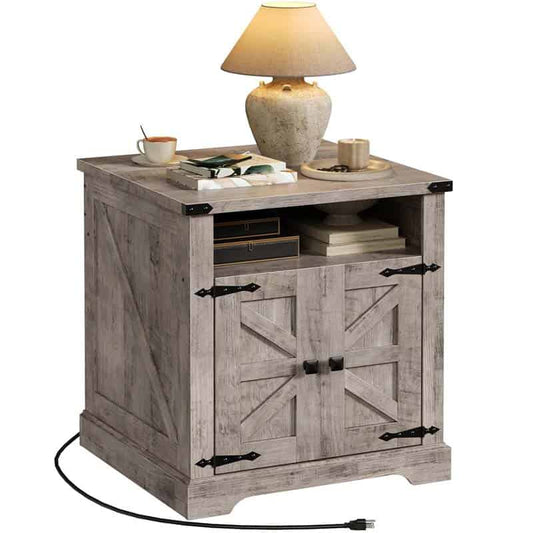 Wooden side table with lamp and items on a white background