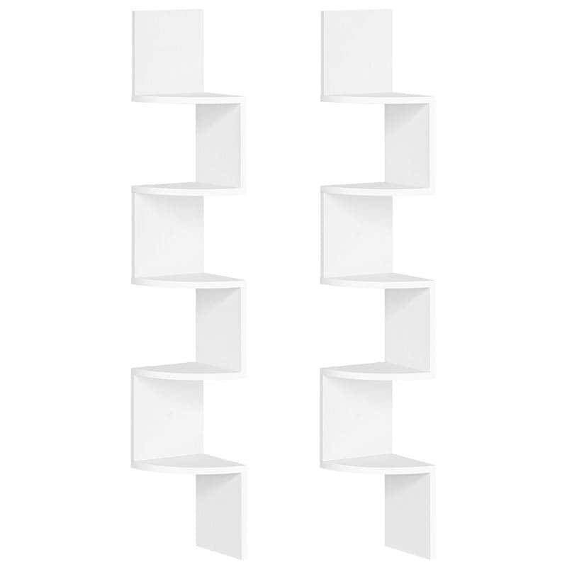 White wall-mounted shelving unit with geometric design on a white background