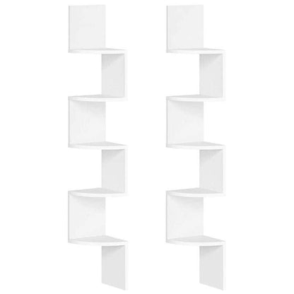 White wall-mounted shelving unit with geometric design on a white background