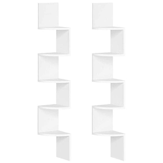 White wall-mounted shelving unit with geometric design on a white background