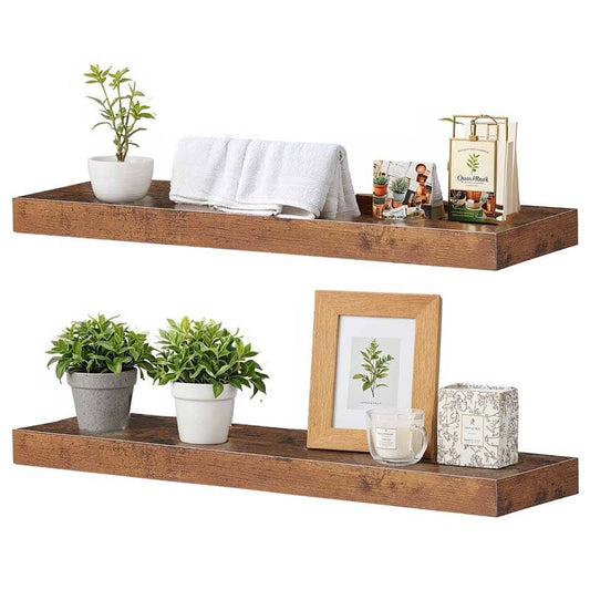 Two pieces of wall-mounted rustic display ledges holding white towels, a photo frame, and small succulent pots.