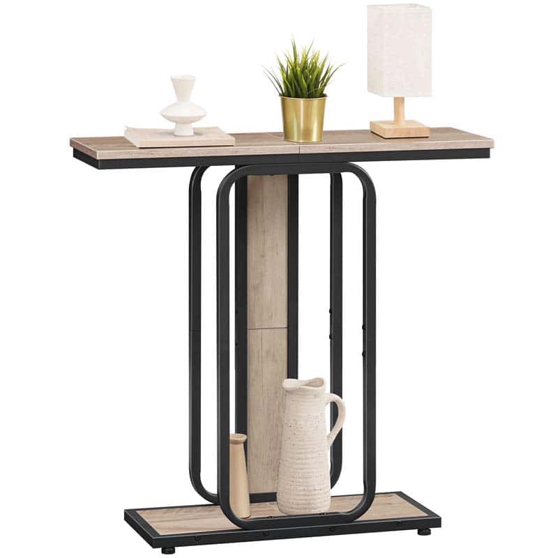 Skinny sofa table with a unique oval metal frame holding a small potted plant and a ceramic pitcher.