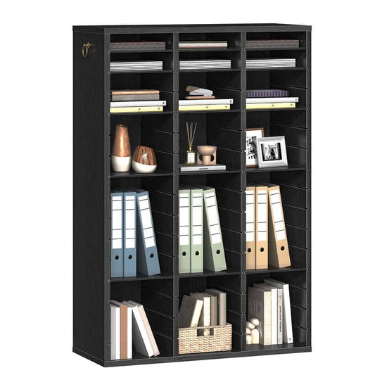 A tall black wire shelving unit with multiple cubbies, shown filled with books, binders, vases, and small decor items against a plain white background.