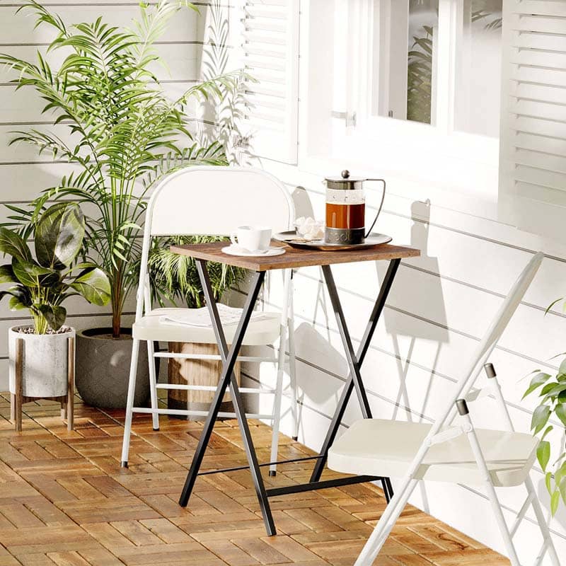 Portable outdoor patio folding table used as a bistro coffee table set with two white chairs.