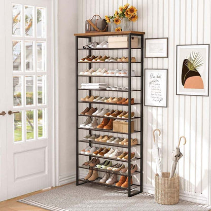 Tall shoe rack with shoes in a room with a door and wall decorations.