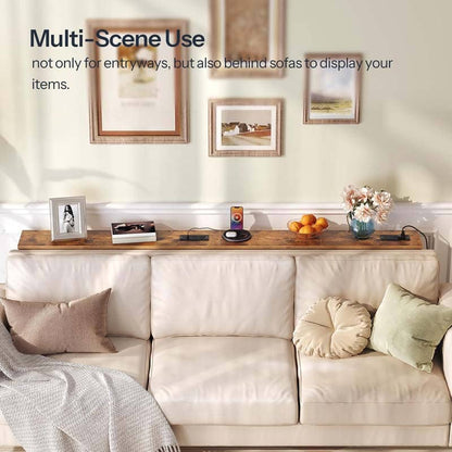 Living room with a console table, sofa, and decorative items.