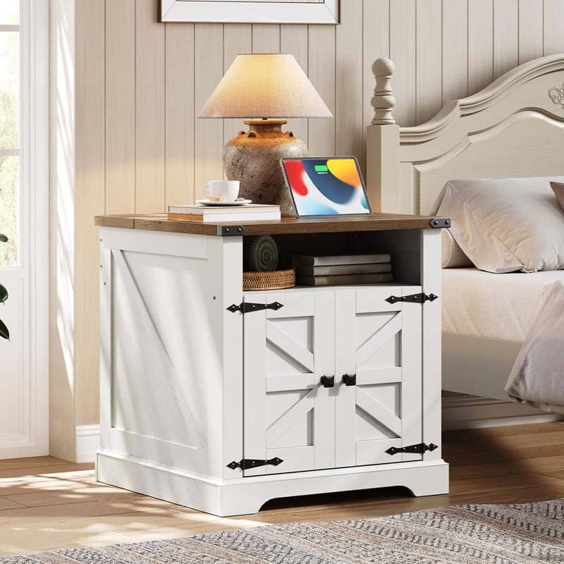 White nightstand with wooden top in a bedroom setting