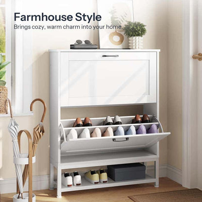 White farmhouse style shoe tower with an open bucket drawer placed next to an open front door in a bright mudroom.