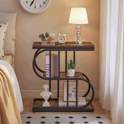 Decorative side table with books, clock, and lamp in a bedroom setting