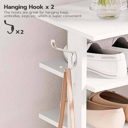 White cabinet with hanging hooks for bags, umbrellas, and keys on a light gray background.