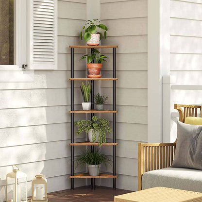 A six-tier corner shelving unit with light brown wood-look shelves and a black metal frame, styled with potted green plants on a porch against a beige siding wall.