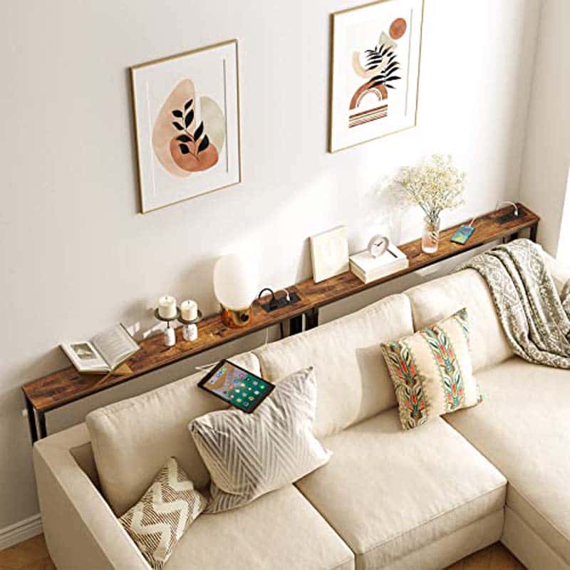 Beige sectional sofa with decorative pillows in a living room setting.