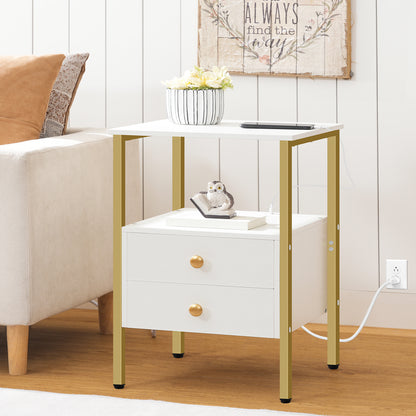 White side table with gold legs next to a beige sofa in a living room setting.