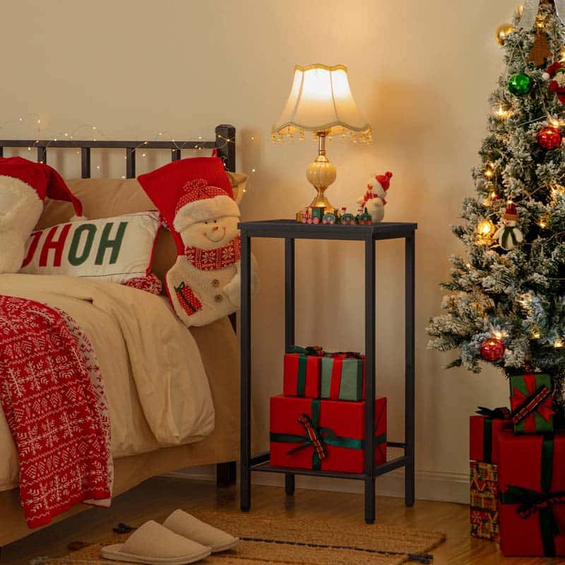 Cozy bedroom with Christmas decorations, including a tree, presents, and festive pillows.