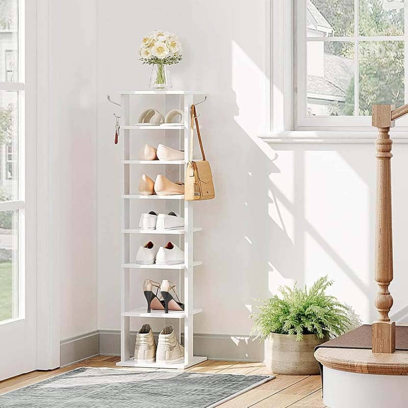 Shoe rack with shoes and a bag in a bright room with a window and plant.