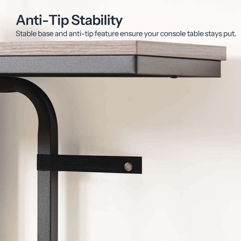 Technical close up demonstrating the console table wall anti-tip safety anchor straps screwed into a wall.