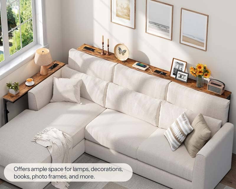 White sectional sofa with wooden shelves and decorative items in a living room.