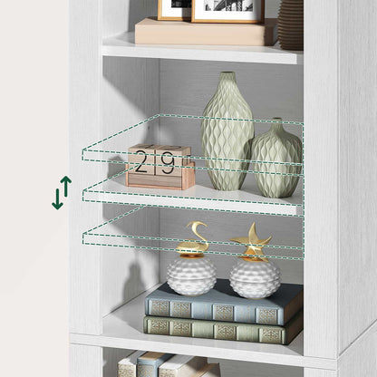White bookshelf with decorative items including vases and books against a light gray wall.