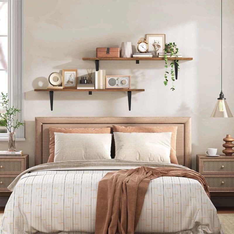 Neatly made bed with wooden headboard in a bedroom setting.