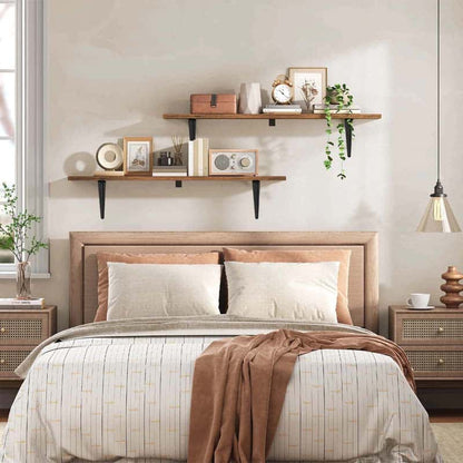 Neatly made bed with wooden headboard in a bedroom setting.