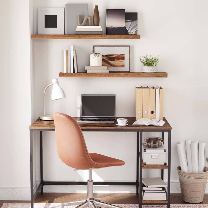 Industrial style study room bookshelf wall-mounted over a computer desk for space saving.