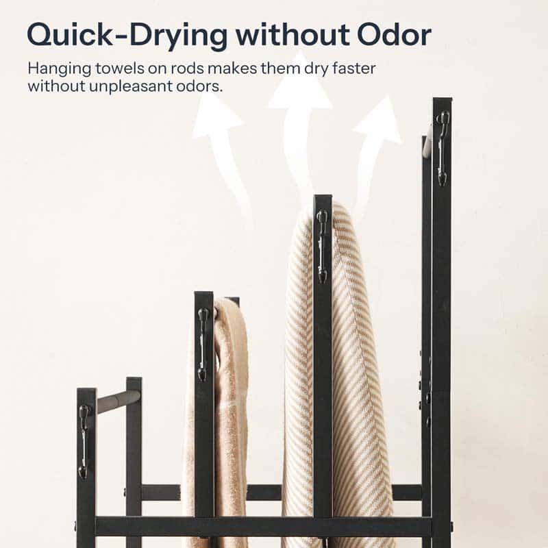 Black metal towel rack with three hanging towels, shown with marketing text reading 'Quick-Drying without Odor' and white airflow arrows on a light beige background.