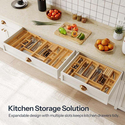 Wooden kitchen drawer organizers with cutlery on a kitchen counter.