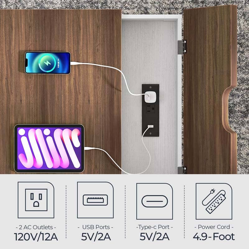 A smart cabinet outlet panel with a wood-grain exterior, shown open with a power strip inserted into a built-in wall outlet. Two smartphones are plugged into the USB ports, and a white charging cable connects them.