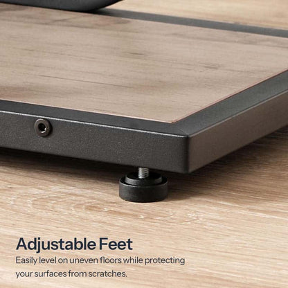 Close up of the sturdy black metal base frame showing 360-degree rotating adjustable leveling feet pegs on wood floor.