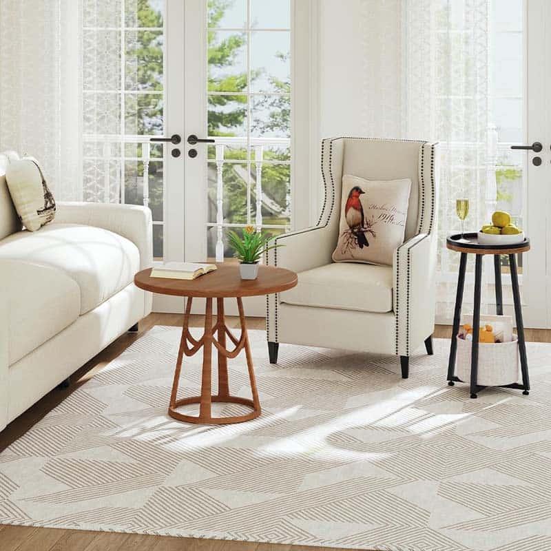 Coordinated industrial living room furniture set showcasing a round coffee table and the matching narrow end table.