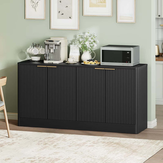 Black sideboard with kitchen appliances against a light green wall.