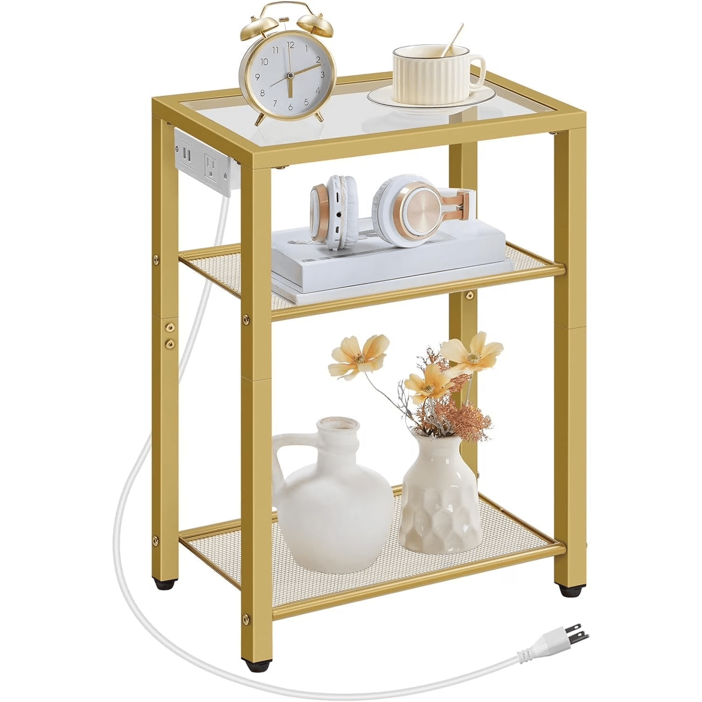 Gold side table with decorative items on a white background