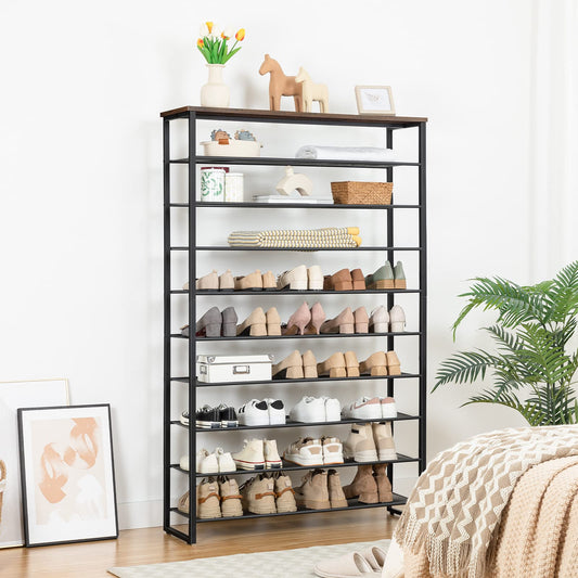Black shoe rack with various shoes on shelves in a room with decor elements.