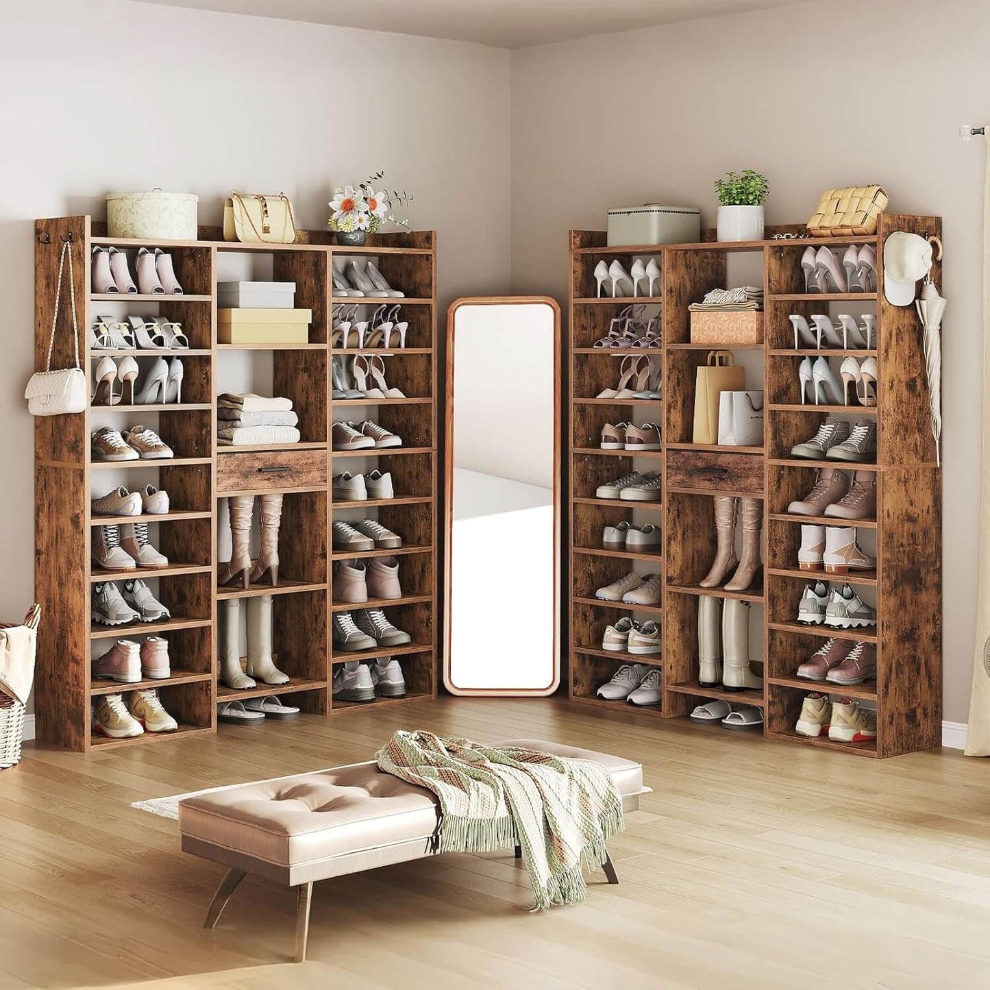 Wooden shoe shelves with various shoes in a room with a mirror and bench.