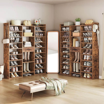 Wooden shoe shelves with various shoes in a room with a mirror and bench.