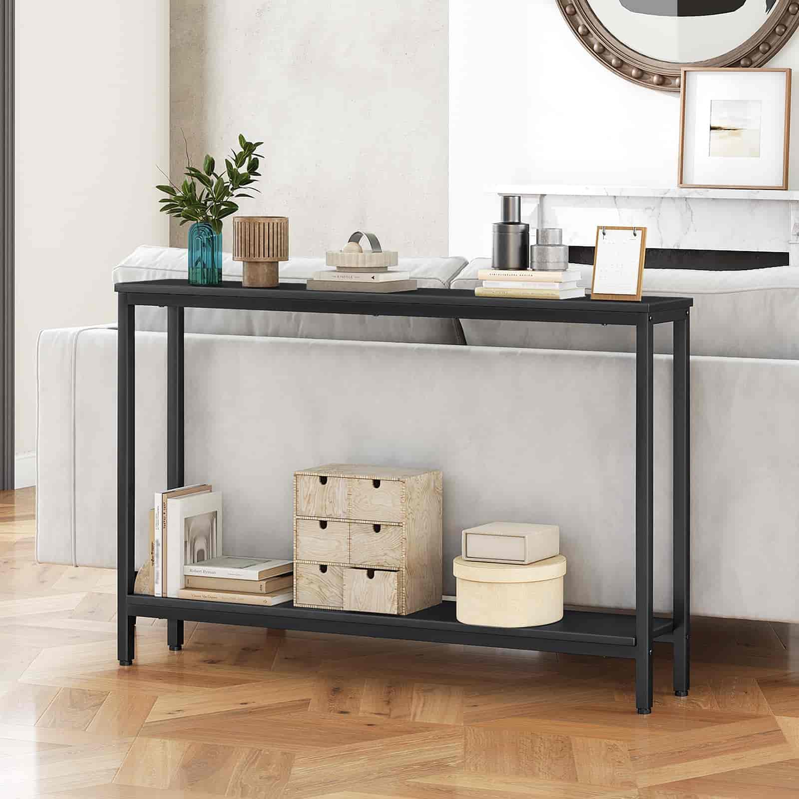Black console table with decorative items in a room setting