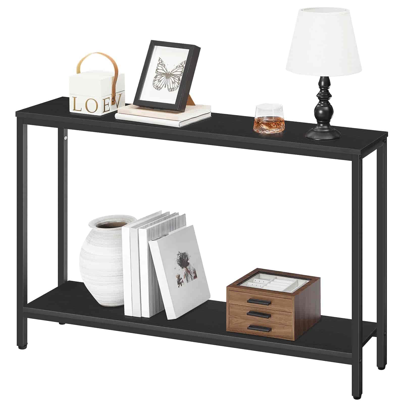 Black console table with decorative items on a white background