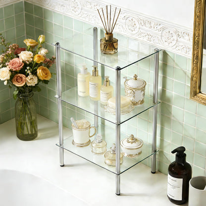 Glass shelf with decorative items against a light green tiled wall.